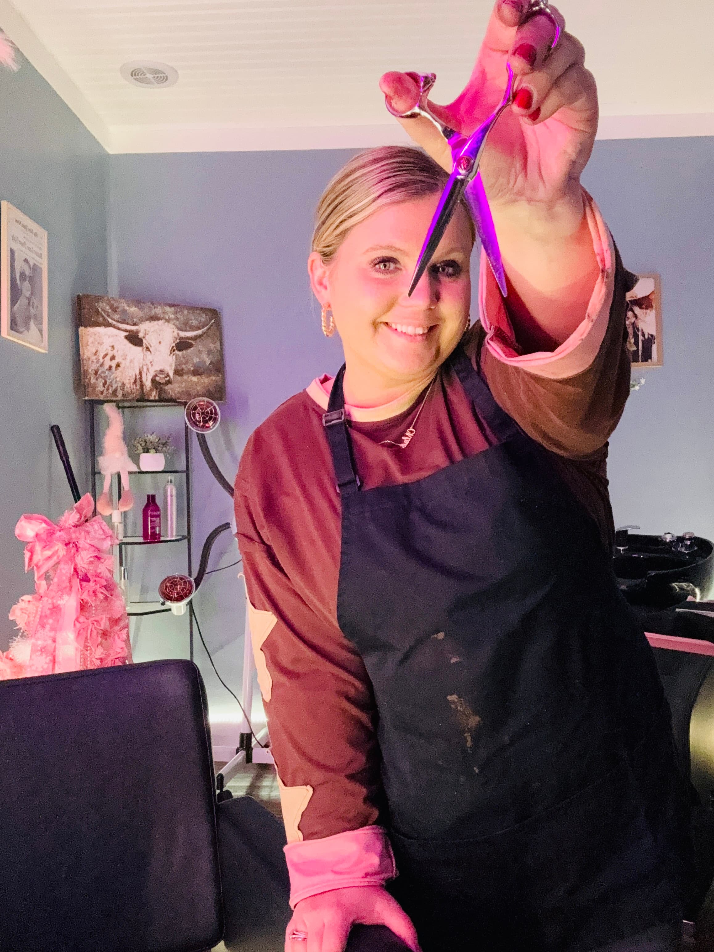 Brooke holding scissors in her salon